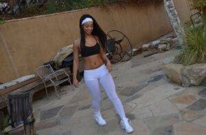 Flexible amateur Latina cutie Teanna Trump works out in yoga pants outdoors on picsofsex.com