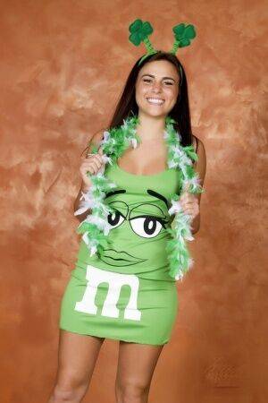 Amateur Kaley Kade flashes while wearing a green M&M dress on St Patty's Day on picsofsex.com