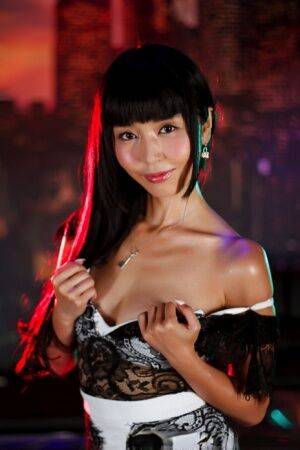 Japanese chick Marica Hase sits naked on a bench after peeling off her clothes - Japan on picsofsex.com