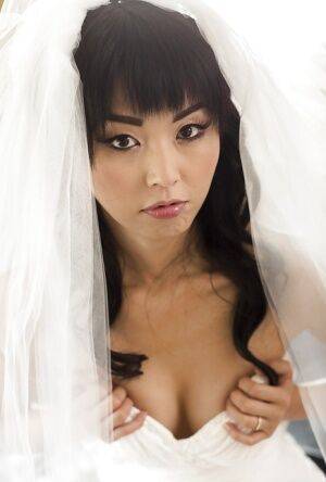 Hot Asian pornstar Marica Hase posing topless in wedding dress on picsofsex.com