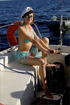 Skinny beauty ditches her bikini to go naked on a boat out on the water on picsofsex.com