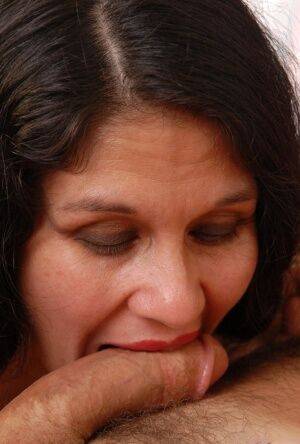 Skinny older woman Carmen giving a handjob and swallowing cum on picsofsex.com