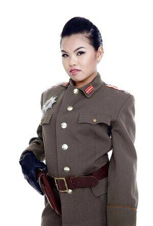 Oriental pornstar Cindy Starfall posing solo in military garb on picsofsex.com