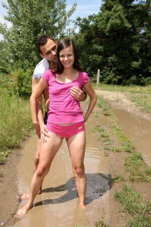 Brunette teen and her boyfriend fuck in the middle of a dirt road in the woods on picsofsex.com