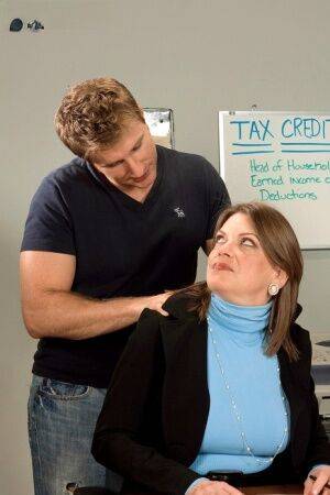 Chubby cougar Randi Layne is seduced by a younger boy during tax season on picsofsex.com