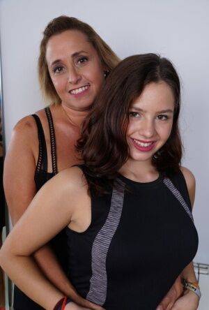 Sweet smiley girl enjoys a steamy pussy licking session with an older woman on picsofsex.com