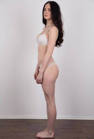 Dark haired female with a firm face model in the nude for the first time on picsofsex.com