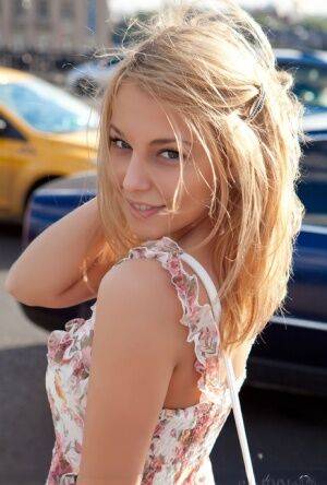 Sweet Nikia A doffs her sun dress to show perky small boobs & hot shaved muff on picsofsex.com