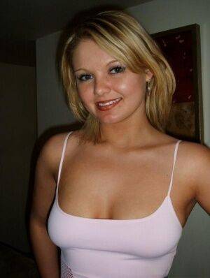 Cute blond girl smokes a cigarette before unleashing her natural tits in jeans on picsofsex.com