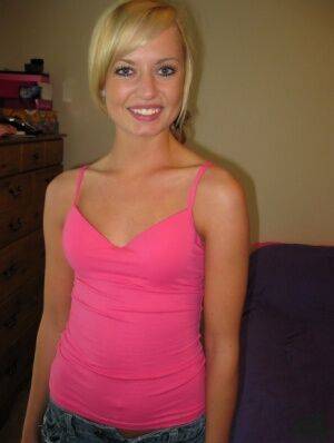 Petite blonde Codie Sweets uncovers her tiny tits as she strips naked on a bed on picsofsex.com