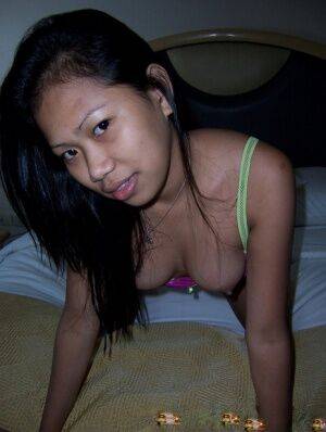 Tiny Filipina girl from the Isles to the South fucks a sex tourist on picsofsex.com