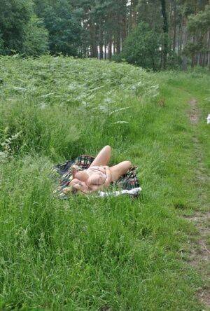 Big titted mature plumper Curvy Claire slides her panties aside in a field on picsofsex.com