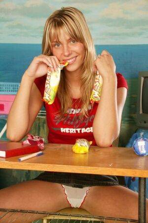 Blonde amateur Sweet Denisa masturbates her pussy over a frozen treat on picsofsex.com