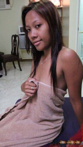 Filipino amateur Leena drips sperm from her ear after sex with a tourist - Philippines on picsofsex.com