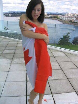 Teen amateur Kate wraps her naked body up in a Canadian flag on picsofsex.com