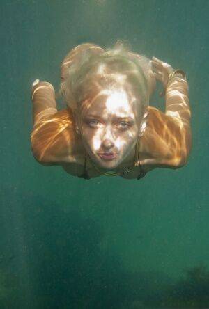 Ukrainian beauty Nika N swims underwater for nude posing inside a cave - Ukraine on picsofsex.com