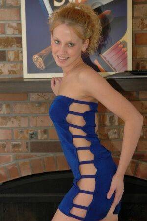 Young blonde Lucky sets her firm tits free of a dress during solo action on picsofsex.com