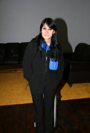 Dark-haired amateur Jennique lets a large boob free from her brassiere on picsofsex.com