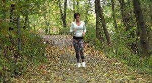 Female jogger Gabriellla Gucci pulls down her leggings for a pee in the woods on picsofsex.com