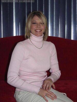 Blonde amateur Kyra frees her perky breasts from turtleneck sweater on picsofsex.com