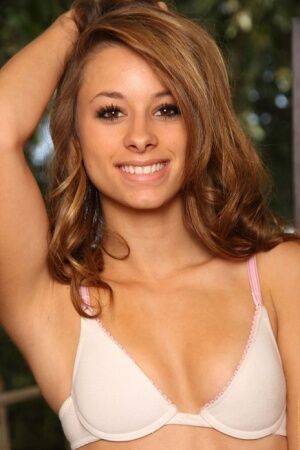 Cute amateur Riley uncovers her tiny tits and tight butt as she strips naked on picsofsex.com
