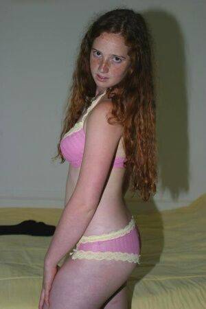 Flexible redhead Rachel showcases her natural pussy after lingerie removal on picsofsex.com