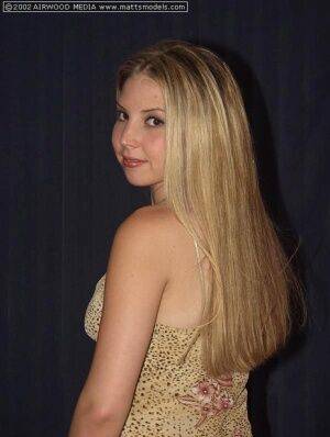 Blonde first timer Jennifer finger spreads her moist pussy in solo action on picsofsex.com