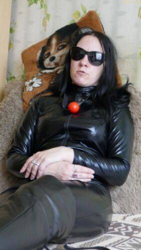 Mystical girl models fully clothed in leather apparel and dark sunglasses on picsofsex.com