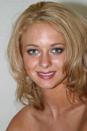Young blonde Tatem uncovers her perky breasts while making her nude debut on picsofsex.com