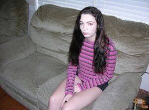 Teen amateur with braces gets completely naked while indoors on picsofsex.com