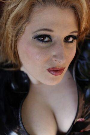 Redheaded female models in latex attire for a non-nude shoot on picsofsex.com