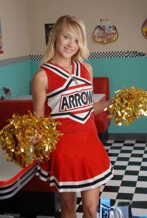 Cute blonde Tegan Summers models non nude in her cheerleader uniform on picsofsex.com