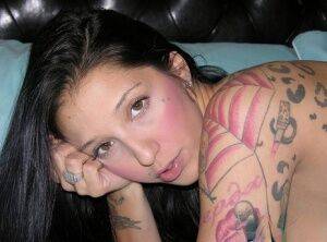 Tattooed brunette Stefania highlights her nice ass during her first nude gig on picsofsex.com