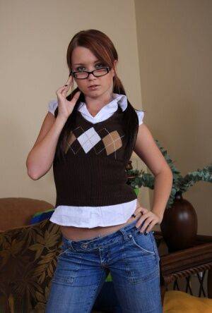 Nerdy amateur Mandy Malone takes off her glasses while getting totally naked on picsofsex.com