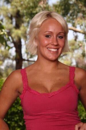 Blonde amateur Tristin gets completely naked on a comfortable armchair on picsofsex.com