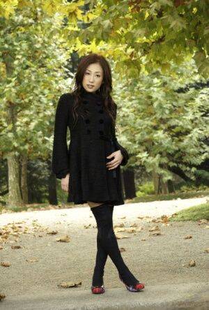 Fully clothed Japanese teen models in the park in black clothes and stockings - Japan on picsofsex.com