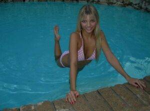 Blonde amateur Jana Jordan models a bikini while in an indoor swimming pool - Jordan on picsofsex.com