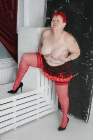 Older woman with short red hair Valgasmic Exposed models lingerie & red nylons on picsofsex.com