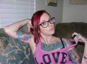 Tattooed redhead Lola takes off her glasses and clothes for her first nudes on picsofsex.com