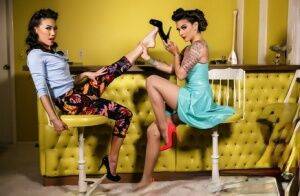 Pinup models Kalina & Kayla Jane Danger partake in lesbian foot play on picsofsex.com