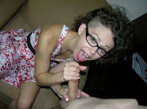 Cute young girl Bailey Paige sucks the cum from a cock while wearing glasses on picsofsex.com