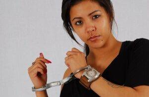 Amateur girl Destiny models a huge OOZOO watch while handcuffed on picsofsex.com