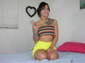 Tattooed brunette Jae Model makes her nude debut by herself on a bed on picsofsex.com