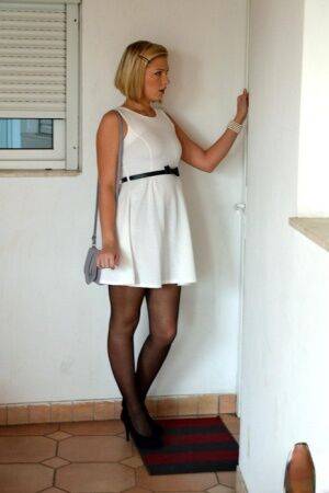 Blonde teen in black nylons and garters shows an older man her nude body on picsofsex.com