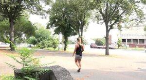 Solo girl Naomi Bennet takes a piss in public while wearing a miniskirt on picsofsex.com