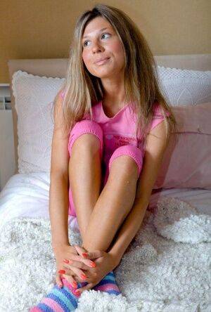 Tiny teen Stephany toys her tight pussy in cute socks during solo action on picsofsex.com