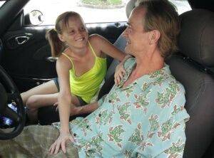 Tiny teen cutie Alyssa Hart in pigtails giving a hot handjob in the car on picsofsex.com