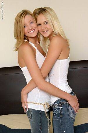 18 year old blonde girls doff tank tops and jeans for lesbian sex on picsofsex.com