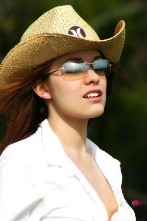 Farm girl in shades and a straw hat unbuttons her shorts and opens her shirt on picsofsex.com