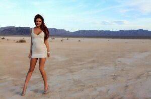 Hot solo model Jayden Cole smokes a cigarette while flashing in the desert on picsofsex.com